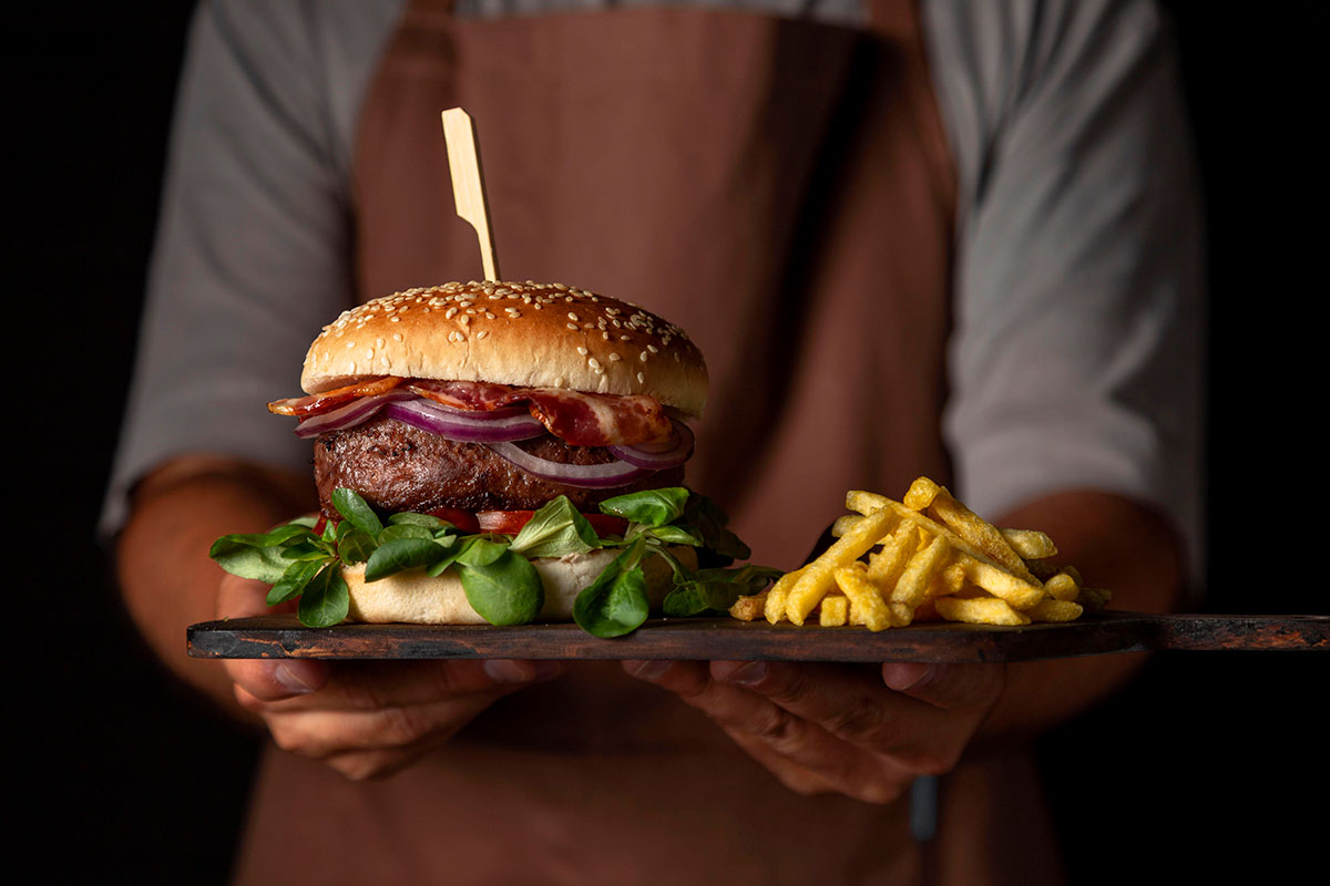 front-view-male-holding-tray-with-burger-fries